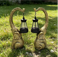 Two Outdoor Solar-Powered Resin Elephant Statues